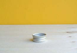 Bouchon aluminium pour flacon en verre
